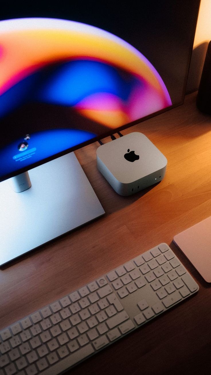 A Mac Studio and display on a desk